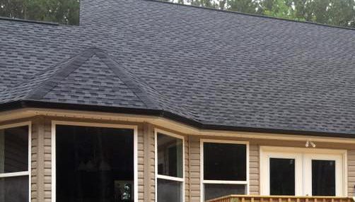 Siding by the Best - new black roof on home